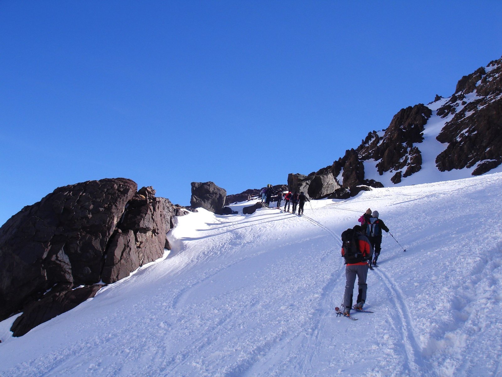 a group of people skiing on a snowy mountain